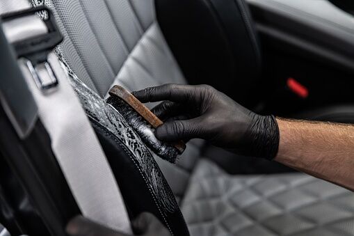 How to clean vomit out of perforated leather seats